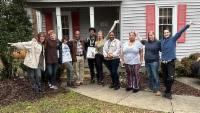 Canvassing team gathered outside a neighborhood home